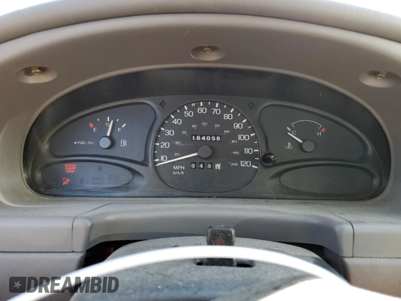 1999 Ford Escort SE z VIN 1FAFP13P2XW277282, wystawiony jako Copart lot #88804865 z przebiegiem 164 056 mil mil oraz Szkoda całkowita • Salvage title. Historia ofert i sprzedaży dostępna na DreamBid. Obrazek 9.