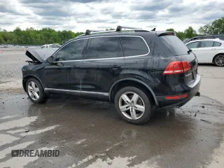2012 Volkswagen Touareg Sport z VIN WVGEF9BP7CD009824, wystawiony jako Copart lot #58311915 z przebiegiem 154 397 mil mil oraz Szkoda całkowita • Salvage title. Historia ofert i sprzedaży dostępna na DreamBid. Obrazek 2.