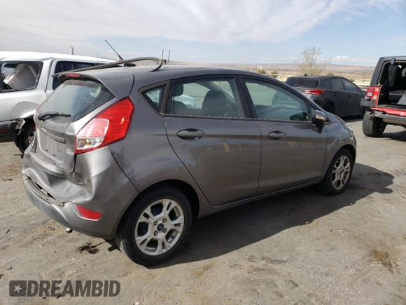 2014 Ford Fiesta SE with VIN 3FADP4EJ0EM195954, listed as a Copart auction lot 51356835 with 75,136 mi miles and Salvage Title. Bid and sale history available at DreamBid. Image 3.