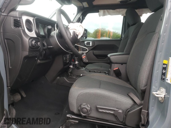 2024 Jeep Wrangler Sport S with VIN 1C4PJXDG1RW305304, listed as a Copart auction lot 57555635 with 5,705 mi miles and Salvage title. Bid and sale history available at DreamBid. Image 7.