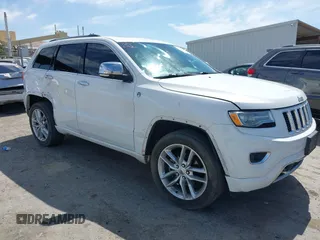 2015 Jeep Grand Cherokee Overland with VIN 1C4RJFCG3FC230185, listed as a IAAI auction lot 42494650 with 123,128 mi miles and . Bid and sale history available at DreamBid. Image 1.