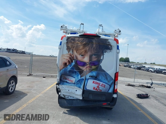 2023 Ford Transit Cargo with VIN 1FTBR1C80PKA43077, listed as a IAAI auction lot 40182475 with 15,656 mi miles and . Bid and sale history available at DreamBid. Image 17.