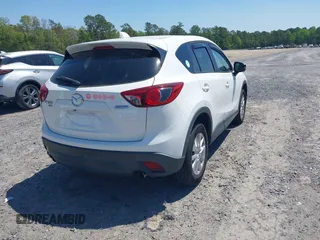 2013 Mazda CX-5 Touring with VIN JM3KE4CE8D0156843, listed as a IAAI auction lot 42018321 with 143,396 mi miles. Bid and sale history available at carsss.com. Image 4.