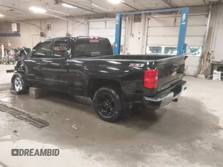 2015 Chevrolet Silverado 1500 LT with VIN 1GCVKREC2FZ417244, listed as a IAAI auction lot 41267554 with 87,735 mi miles and . Bid and sale history available at DreamBid. Image 3.