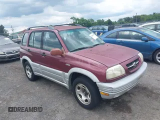 2000 Suzuki Grand Vitara JLX z VIN JS3TD62V7Y4119022, wystawiony jako IAAI lot #42384608 z przebiegiem 153 943 mil mil oraz . Historia ofert i sprzedaży dostępna na DreamBid. Obrazek 1.