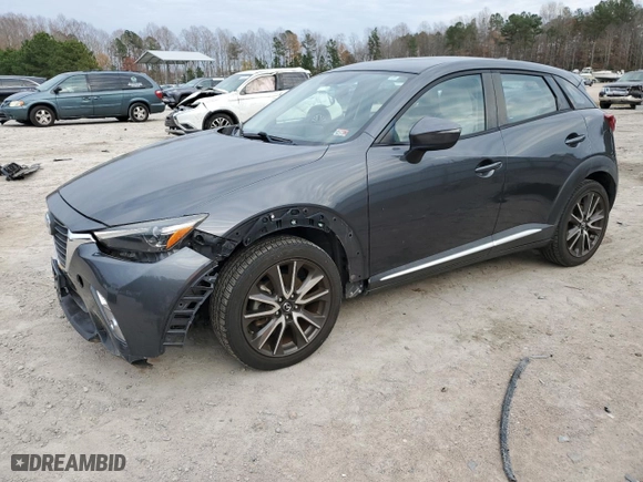 2016 Mazda CX-3 Grand Touring with VIN JM1DKBD72G0103803, listed as a Copart auction lot 82769204 with 91,727 mi miles and Salvage Title. Bid and sale history available at carsss.com. Image 1.