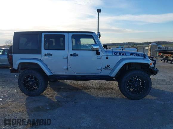 2010 Jeep Wrangler Unlimited Sahara with VIN 1J4BA5H14AL230604, listed as a IAAI auction lot 41884346 with 97,060 mi miles. Bid and sale history available at carsss.com. Image 13.