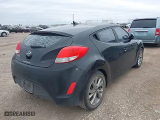 2016 Hyundai Veloster with VIN KMHTC6AD4GU281940, listed as a IAAI auction lot 41261313 with 88,118 mi miles. Bid and sale history available at carsss.com. Image 4.