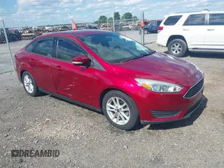 2015 Ford Focus SE z VIN 1FADP3F29FL338923, wystawiony jako IAAI lot #42368244 z przebiegiem 84 844 mil mil oraz . Historia ofert i sprzedaży dostępna na DreamBid. Obrazek 1.