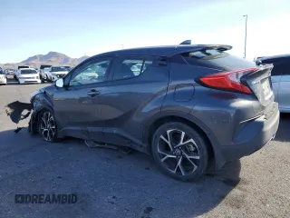 2021 Toyota C-HR LE z VIN NMTKHMBX8MR130564, wystawiony jako Copart lot #56711535 z przebiegiem 94 007 mil mil oraz Szkoda całkowita • Salvage title. Historia ofert i sprzedaży dostępna na DreamBid. Obrazek 2.