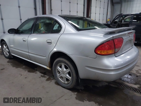 2003 Oldsmobile Alero GL1 z VIN 1G3NL52F53C112582, wystawiony jako IAAI lot #41926039 z przebiegiem 124 769 mil mil oraz . Historia ofert i sprzedaży dostępna na DreamBid. Obrazek 3.