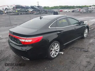 2013 Hyundai Azera z VIN KMHFH4JG5DA328645, wystawiony jako IAAI lot #42531226 z przebiegiem 82 403 mil mil oraz . Historia ofert i sprzedaży dostępna na DreamBid. Obrazek 4.