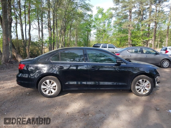 2015 Volkswagen Jetta SE z VIN 3VWD07AJ1FM277499, wystawiony jako IAAI lot #42085122 z przebiegiem 122 754 mil mil oraz . Historia ofert i sprzedaży dostępna na DreamBid. Obrazek 13.