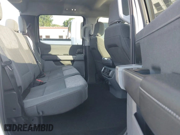 2023 Ford F-150 Lightning Pro with VIN 1FTVW1EL6PWG34059, listed as a IAAI auction lot 42010900 with 20,759 mi miles and . Bid and sale history available at DreamBid. Image 8.