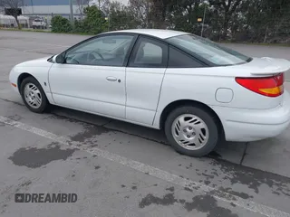 1999 Saturn SC with VIN 1G8ZY1271XZ276834, listed as a IAAI auction lot 41445985 with 62,428 mi miles. Bid and sale history available at carsss.com. Image 3.