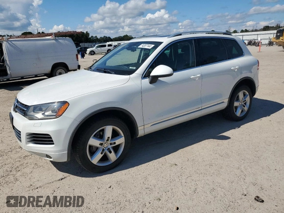 2014 Volkswagen Touareg Lux z VIN WVGEF9BP4ED011436, wystawiony jako Copart lot #74207144 z przebiegiem 207 059 mil mil oraz Szkoda całkowita • Salvage title. Historia ofert i sprzedaży dostępna na DreamBid. Obrazek 1.