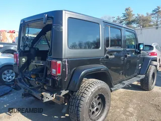 2018 Jeep Wrangler JK Unlimited Sahara with VIN 1C4HJWEG8JL921293, listed as a IAAI auction lot 41413264 with 90,566 mi miles. Bid and sale history available at carsss.com. Image 4.
