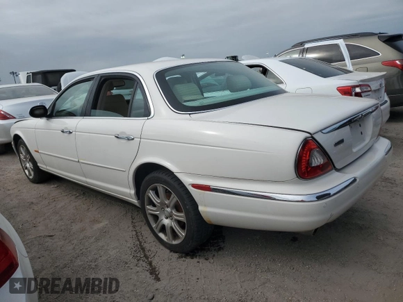 2004 Jaguar XJ with VIN SAJWA71C44SG34094, listed as a Copart auction lot 74969004 with 0 mi miles and Salvage Title. Bid and sale history available at carsss.com. Image 2.