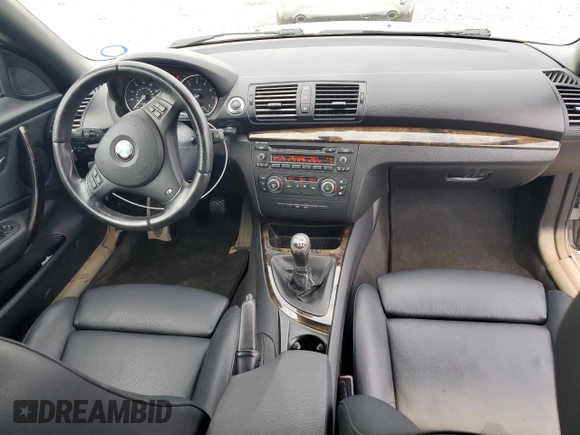 2012 BMW 1 Series 135i with VIN WBAUN7C59CVM26082, listed as a Copart auction lot 74711754 with 77,152 mi miles and Salvage title. Bid and sale history available at DreamBid. Image 8.