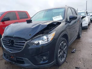 2016 Mazda CX-5 Grand Touring z VIN JM3KE4DY9G0605489, wystawiony jako IAAI lot #42085160 z przebiegiem 160 338 mil mil oraz . Historia ofert i sprzedaży dostępna na DreamBid. Obrazek 2.