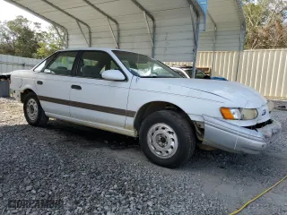1992 Ford Taurus GL with VIN 1FALP52U5NA280821, listed as a Copart auction lot 77457304 with 33,484 mi miles and Salvage Title. Bid and sale history available at carsss.com. Image 4.