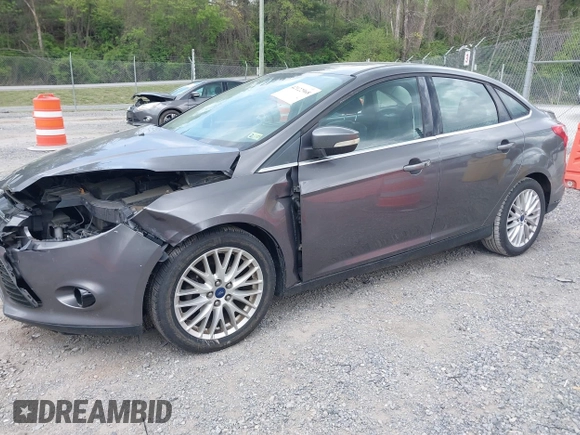 2013 Ford Focus Titanium with VIN 1FADP3J28DL225887, listed as a IAAI auction lot 42122968 with 139,248 mi miles and . Bid and sale history available at carsss.com. Image 2.