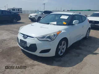 2014 Hyundai Veloster RE:FLEX z VIN KMHTC6AD5EU201168, wystawiony jako IAAI lot #41930766 z przebiegiem 198 909 mil mil oraz . Historia ofert i sprzedaży dostępna na DreamBid. Obrazek 2.