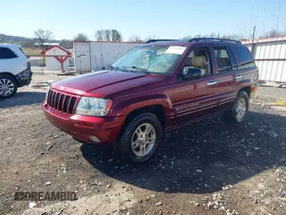 1999 Jeep Grand Cherokee Limited with VIN 1J4GW68N3XC770468, listed as a IAAI auction lot 41793600 with 65,277 mi miles. Bid and sale history available at carsss.com. Image 2.
