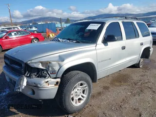 1998 Dodge Durango z VIN 1B4HS28Y1WF132982, wystawiony jako IAAI lot #41890256 z przebiegiem 112 690 mil mil oraz . Historia ofert i sprzedaży dostępna na DreamBid. Obrazek 2.