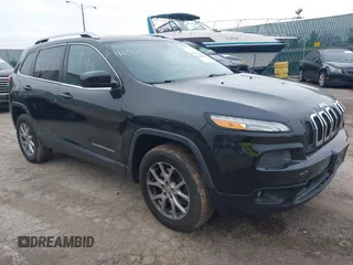 2014 Jeep Cherokee Latitude z VIN 1C4PJMCS5EW219542, wystawiony jako IAAI lot #40950309 z przebiegiem 154 099 mil mil oraz . Historia ofert i sprzedaży dostępna na DreamBid. Obrazek 1.