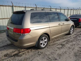 2010 Honda Odyssey Touring with VIN 5FNRL3H9XAB094779, listed as a IAAI auction lot 40412812 with 145,533 mi miles. Bid and sale history available at carsss.com. Image 4.