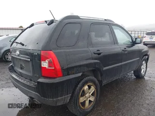 2009 Kia Sportage LX with VIN KNDJE723497612745, listed as a IAAI auction lot 41974301 with 141,110 mi miles and . Bid and sale history available at carsss.com. Image 4.