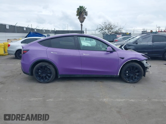2021 Tesla Model Y Long Range with VIN 5YJYGDEE7MF224531, listed as a IAAI auction lot 38454442 with 52,408 mi miles. Bid and sale history available at carsss.com. Image 14.