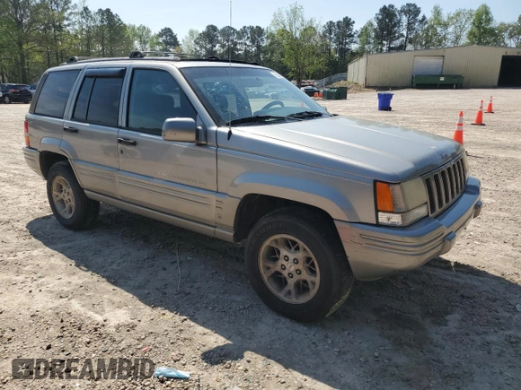 1998 Jeep Grand Cherokee Limited with VIN 1J4GZ78YXWC160346, listed as a Copart auction lot 52595655 with Not provided miles and Salvage title. Bid and sale history available at DreamBid. Image 4.