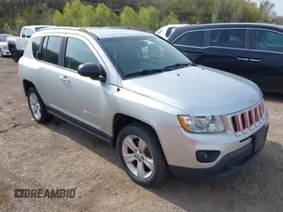 2013 Jeep Compass Sport with VIN 1C4NJDBB4DD119077, listed as a IAAI auction lot 42142532 with 131,679 mi miles. Bid and sale history available at carsss.com. Image 1.
