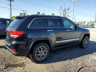 2013 Jeep Grand Cherokee Overland with VIN 1C4RJFCG2DC653207, listed as a Copart auction lot 48680885 with 276,020 mi miles and Salvage Title. Bid and sale history available at carsss.com. Image 3.
