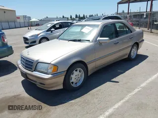 2000 Mercedes-Benz C 230/260/280/320 z VIN WDBHA29G1YA802945, wystawiony jako IAAI lot #42524661 z przebiegiem 161 227 mil mil oraz . Historia ofert i sprzedaży dostępna na DreamBid. Obrazek 2.