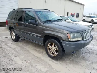 2004 Jeep Grand Cherokee Laredo with VIN 1J4GX48N74C412982, listed as a IAAI auction lot 41496258 with 195,671 mi miles. Bid and sale history available at carsss.com. Image 1.