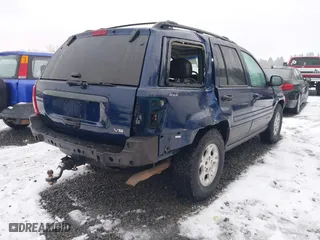 2001 Jeep Grand Cherokee Laredo with VIN 1J4GW48N21C730703, listed as a IAAI auction lot 41581667 with 111,054 mi miles. Bid and sale history available at carsss.com. Image 4.