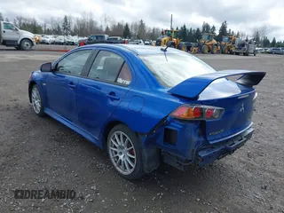 2015 Mitsubishi Lancer Evolution GSR with VIN JA32W8FV4FU012578, listed as a IAAI auction lot 41730742 with 64,762 mi miles. Bid and sale history available at carsss.com. Image 3.