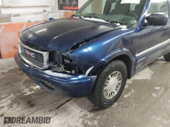 1999 GMC Jimmy SLE z VIN 1GKDT13W8X2534672, wystawiony jako IAAI lot #41562434 z przebiegiem 240 145 mil mil oraz . Historia ofert i sprzedaży dostępna na DreamBid. Obrazek 6.