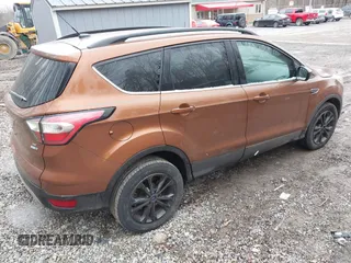 2017 Ford Escape SE with VIN 1FMCU9G96HUC12475, listed as a IAAI auction lot 41741342 with 102,823 mi miles. Bid and sale history available at carsss.com. Image 4.