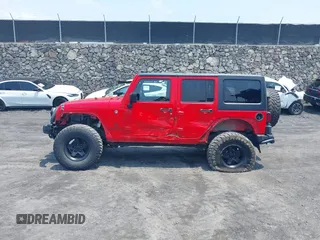 2014 Jeep Wrangler Unlimited Rubicon with VIN 1C4BJWFG0EL326979, listed as a IAAI auction lot 41913129 with 118,548 mi miles and . Bid and sale history available at DreamBid. Image 6.