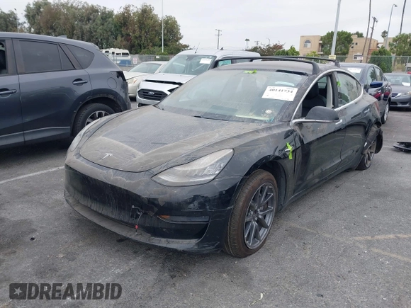 2019 Tesla Model 3 Mid Range with VIN 5YJ3E1EA2KF362048, listed as a IAAI auction lot 40141734 with 70,321 mi miles and . Bid and sale history available at carsss.com. Image 18.