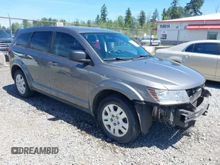 2013 Dodge Journey SE z VIN 3C4PDCABXDT710245, wystawiony jako IAAI lot #42353905 z przebiegiem 135 528 mil mil oraz . Historia ofert i sprzedaży dostępna na DreamBid. Obrazek 1.