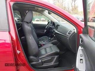 2016 Mazda CX-5 Grand Touring with VIN JM3KE4DY9G0865780, listed as a IAAI auction lot 41913914 with 76,579 mi miles. Bid and sale history available at carsss.com. Image 5.