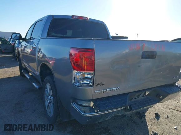 2012 Toyota Tundra 4WD Truck LTD with VIN 5TFHW5F18CX251584, listed as a IAAI auction lot 41054238 with 124,892 mi miles. Bid and sale history available at carsss.com. Image 3.