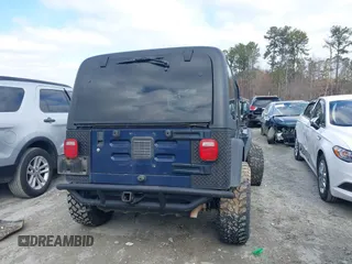 2006 Jeep Wrangler Sport with VIN 1J4FA49S66P732419, listed as a IAAI auction lot 41607851 with 120,099 mi miles. Bid and sale history available at carsss.com. Image 16.