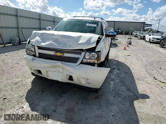 2012 Chevrolet Tahoe LTZ with VIN 1GNSCCE08CR214560, listed as a Copart auction lot 44723175 with 137,489 mi miles and Salvage title. Bid and sale history available at DreamBid. Image 14.