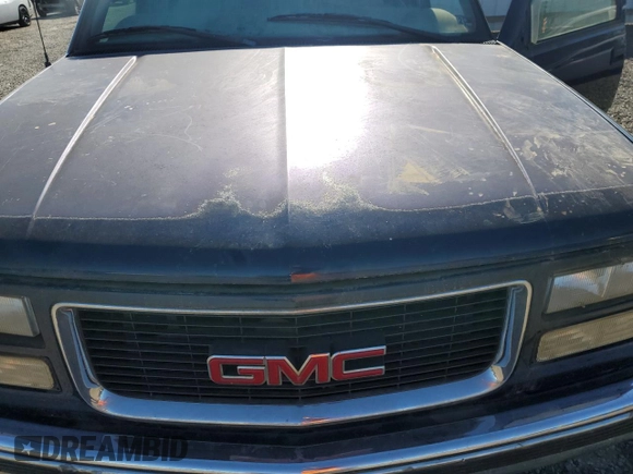 1999 GMC Yukon with VIN 1GKEK13R3XJ757466, listed as a Copart auction lot 75750884 with 270,768 mi miles and Salvage Title. Bid and sale history available at carsss.com. Image 12.
